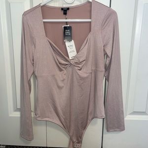 Light pink, long sleeve shimmer bodysuit from Express. Never worn, tag still on!